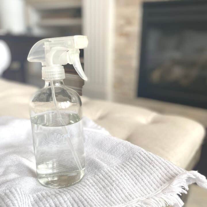 spray bottle containing vinegar for cleaning