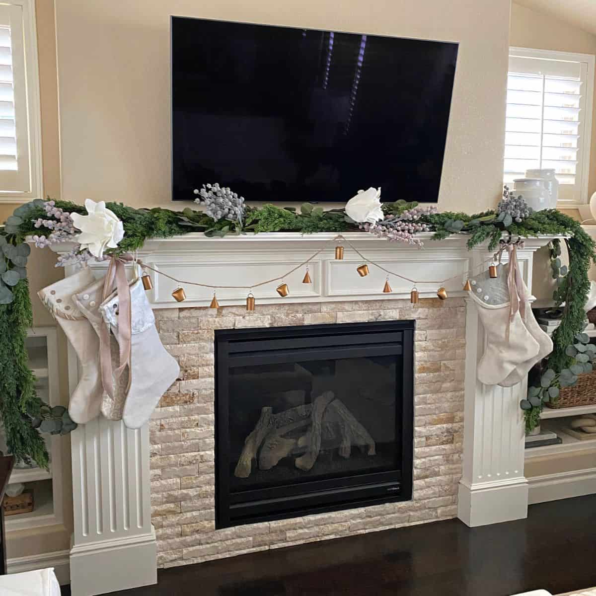 Fireplace mantel with pastel Christmas decorations