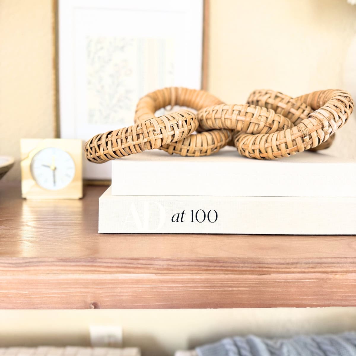ad at 100 book styled on console table