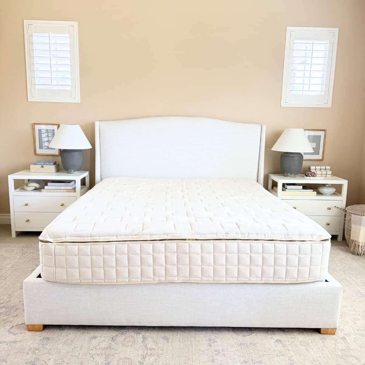 organic mattress on upholstered bed frame