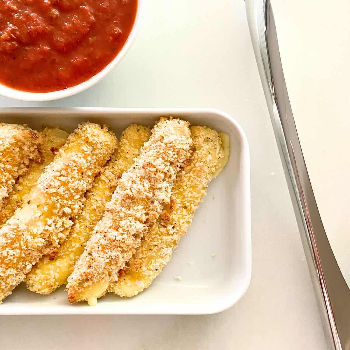 homemade cheese sticks with sauce