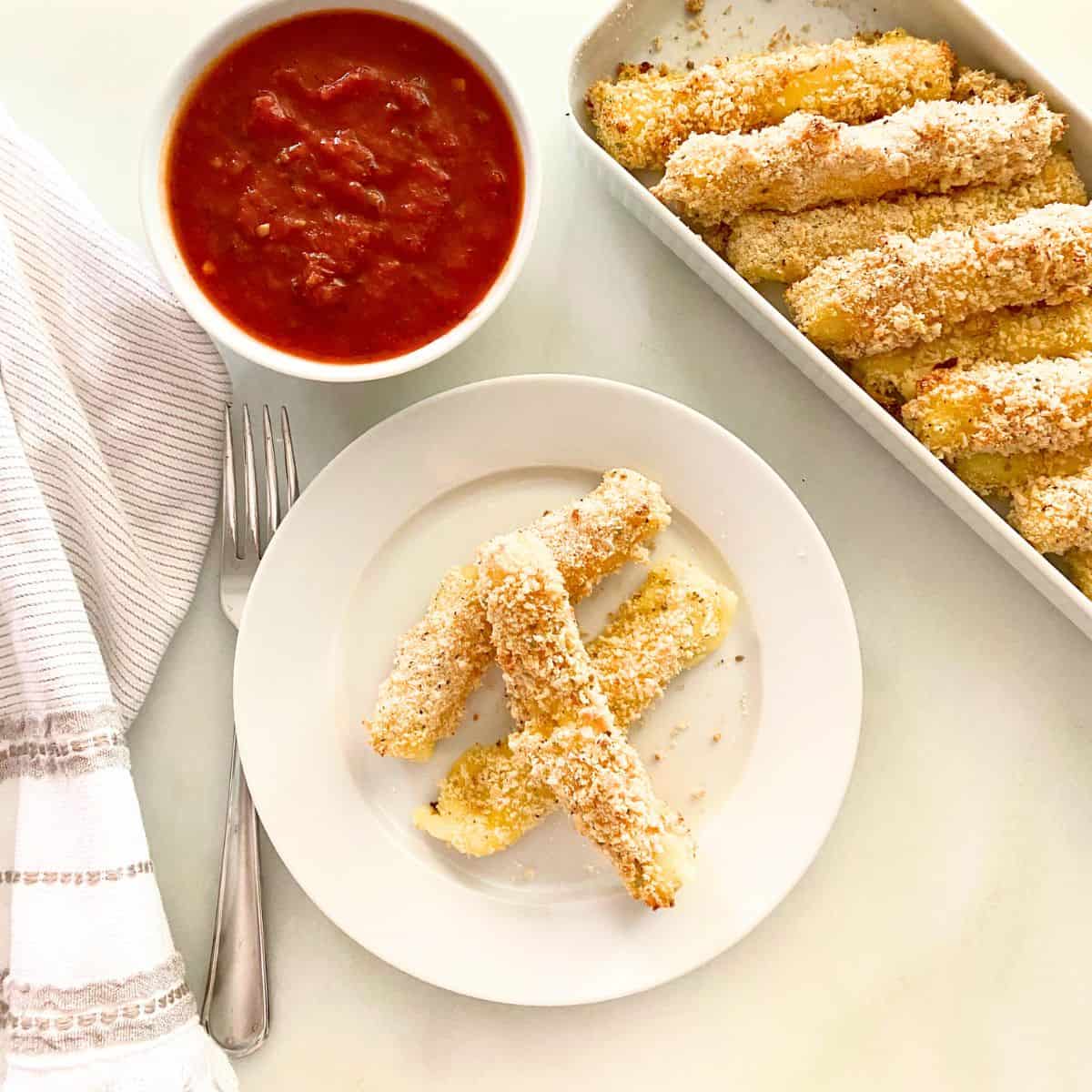 appetizer plate of baked cheese sticks