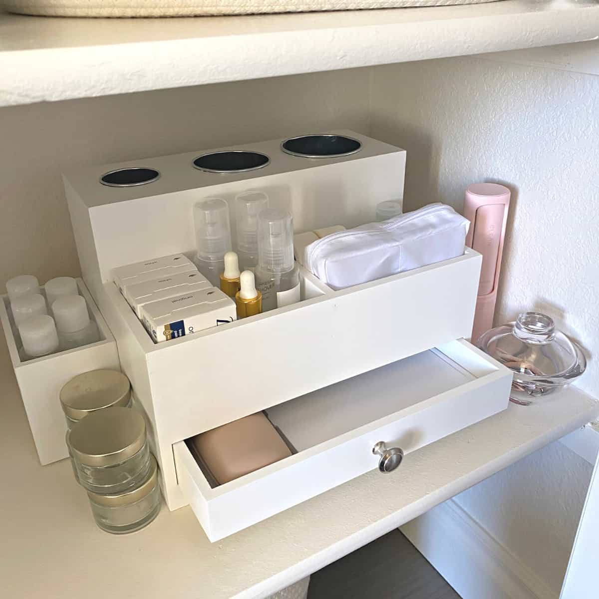 White wood hair tools and toiletries organizer