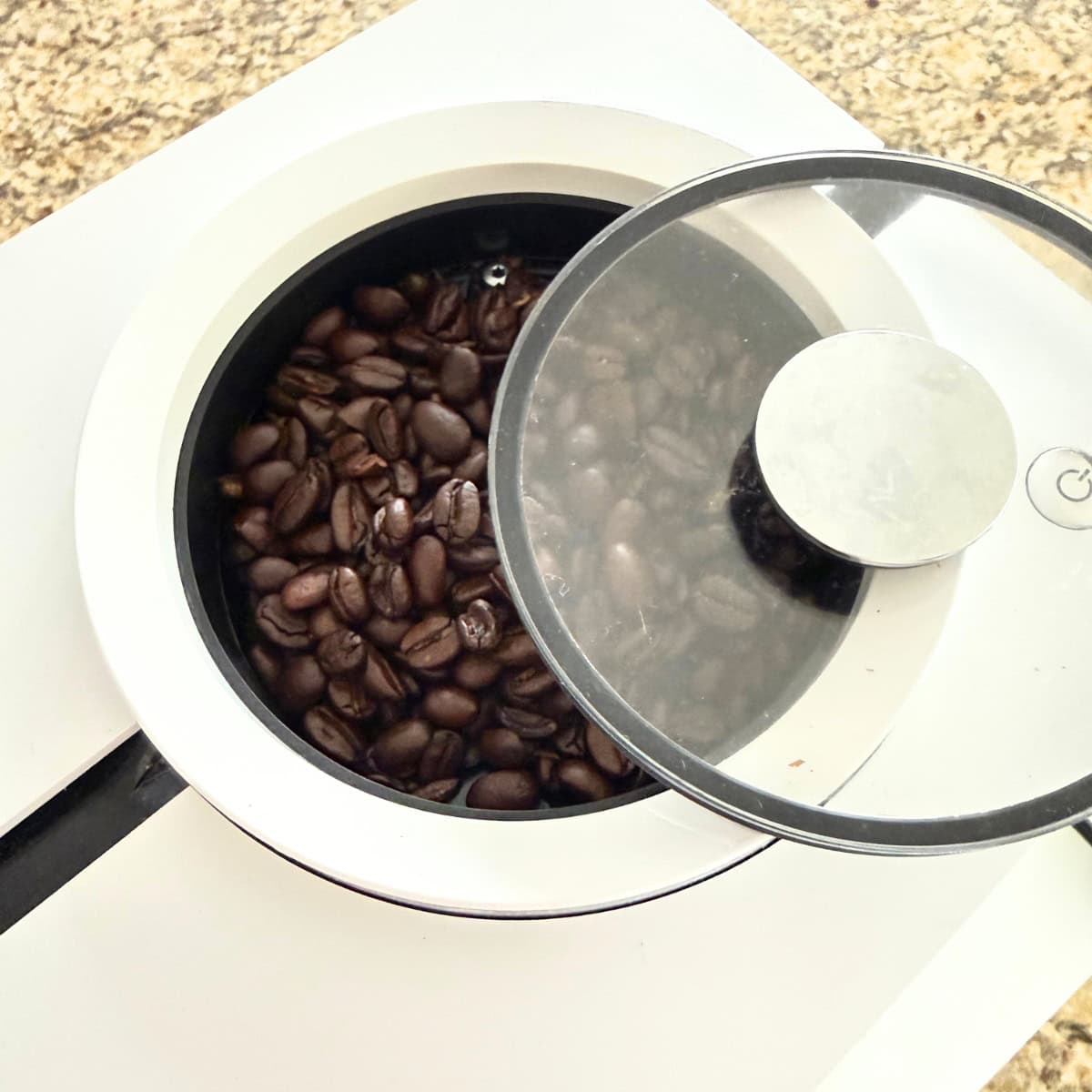 bean hopper on a jura coffee maker with lid askew