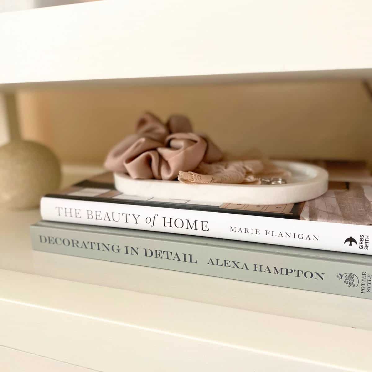 marble tray atop two stacked books