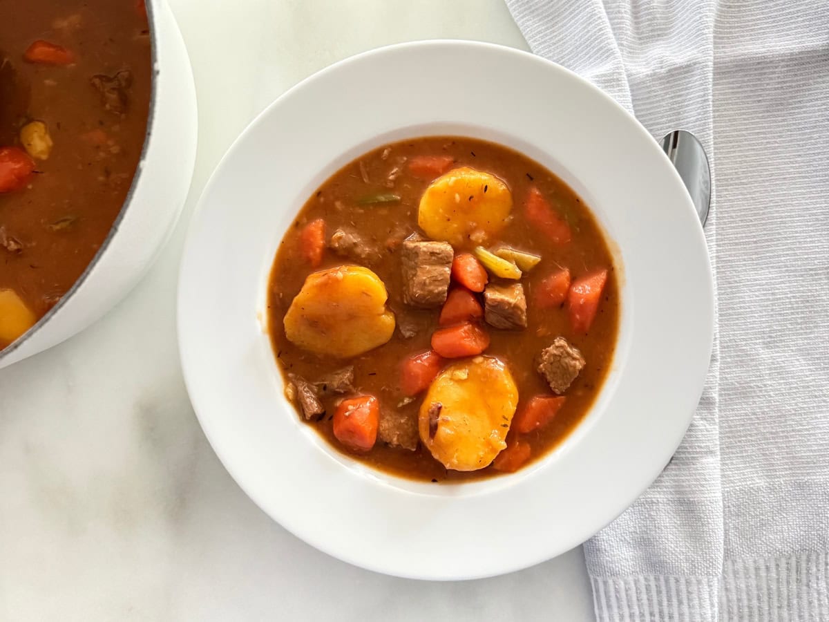 homemade beef stew served in white porcelain bowl