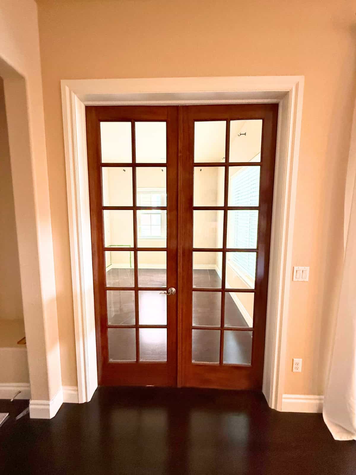 dark stained French doors before painting white
