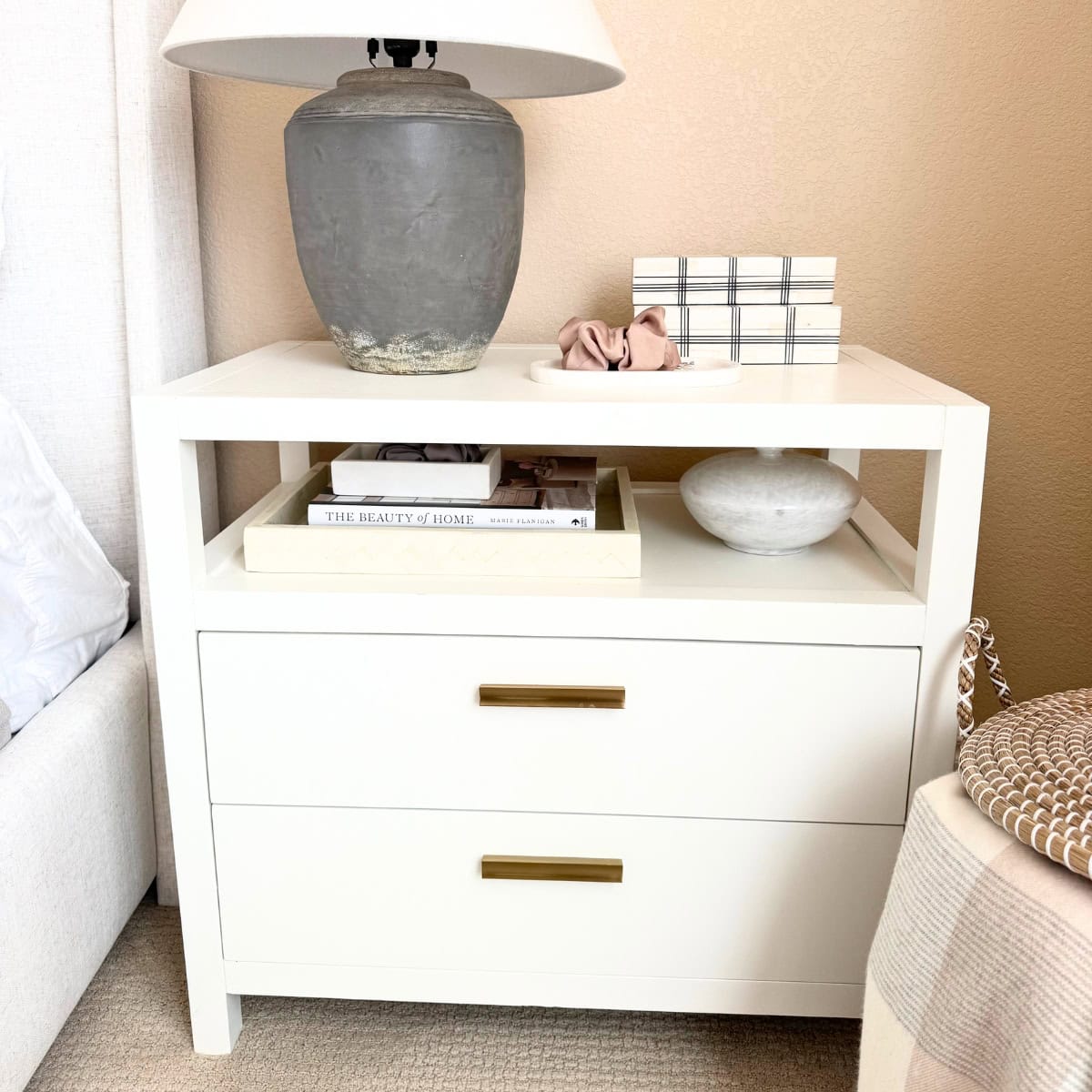 white nightstand with brass pulls
