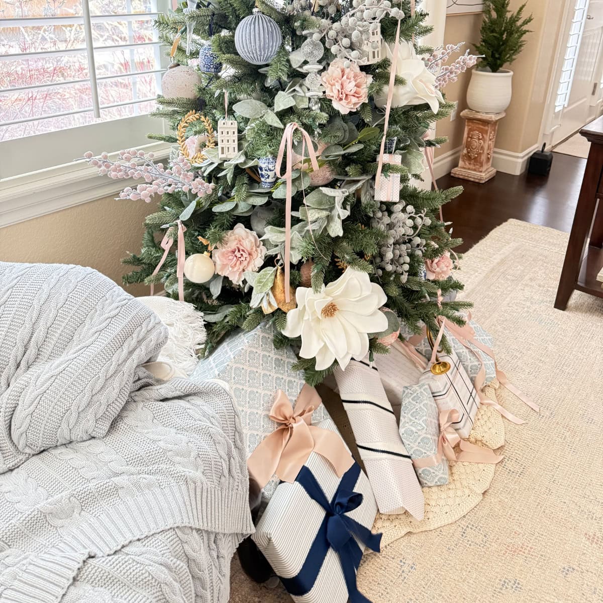 presents under decorated christmas tree