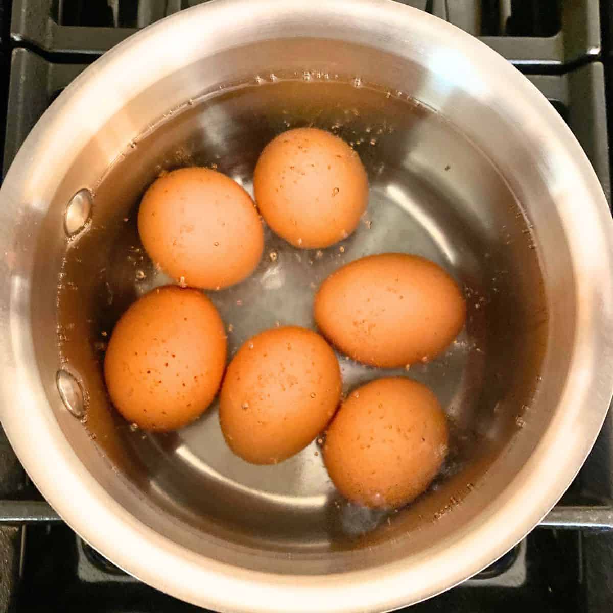 Brown eggs boiling
