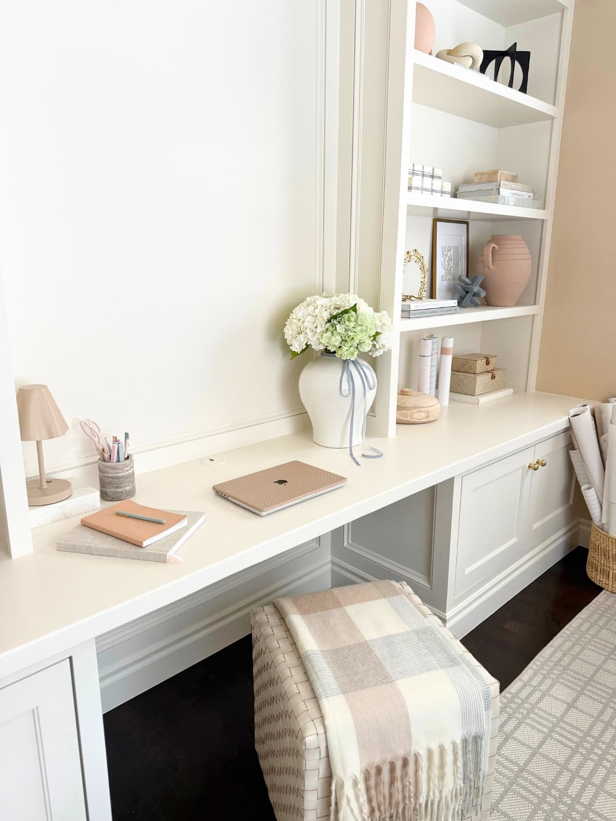 home office built-in desk painted white with ottoman