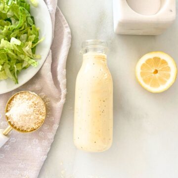 homemade Caesar salad dressing in a glass bottle