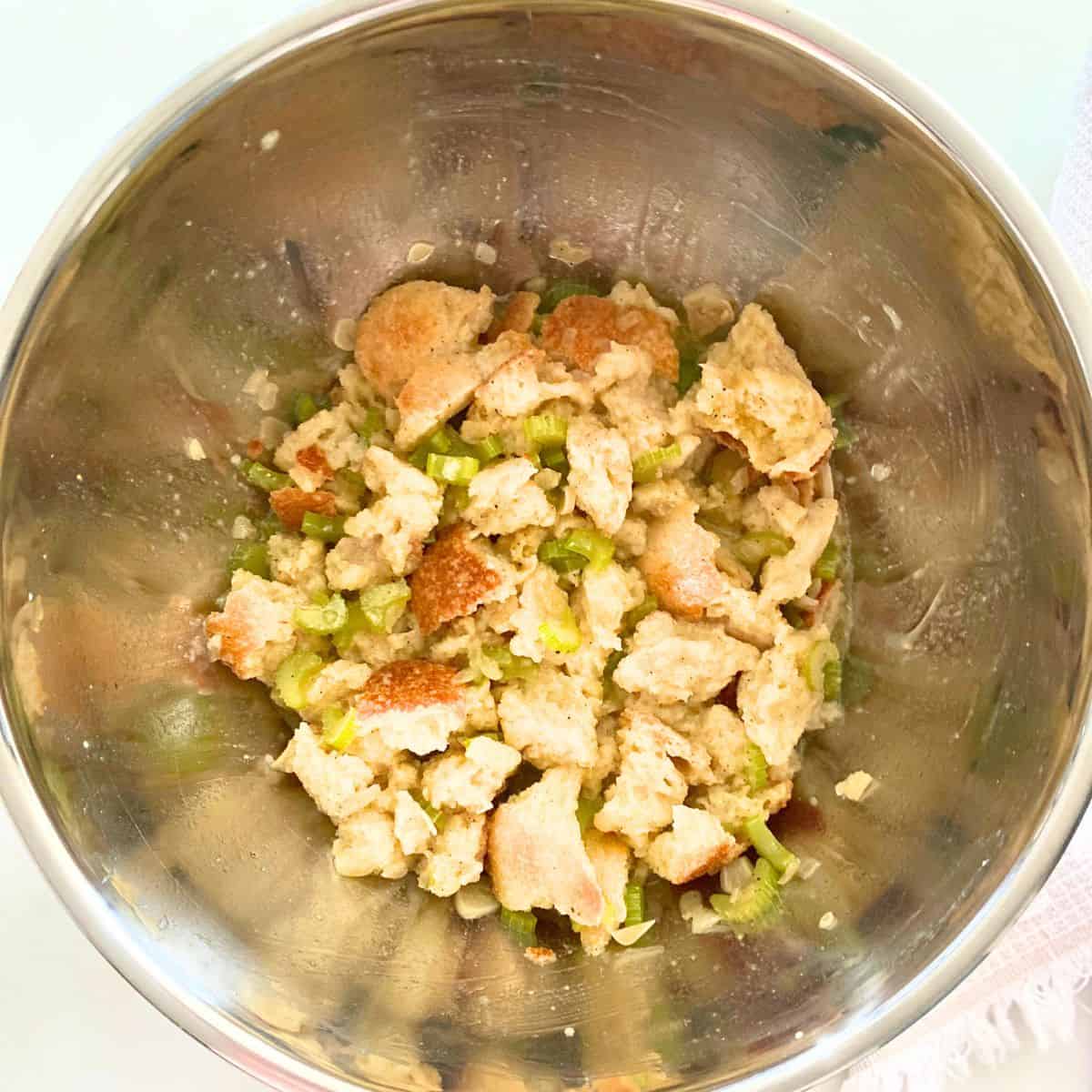 stainless steel mixing bowl with ingredients for stuffing