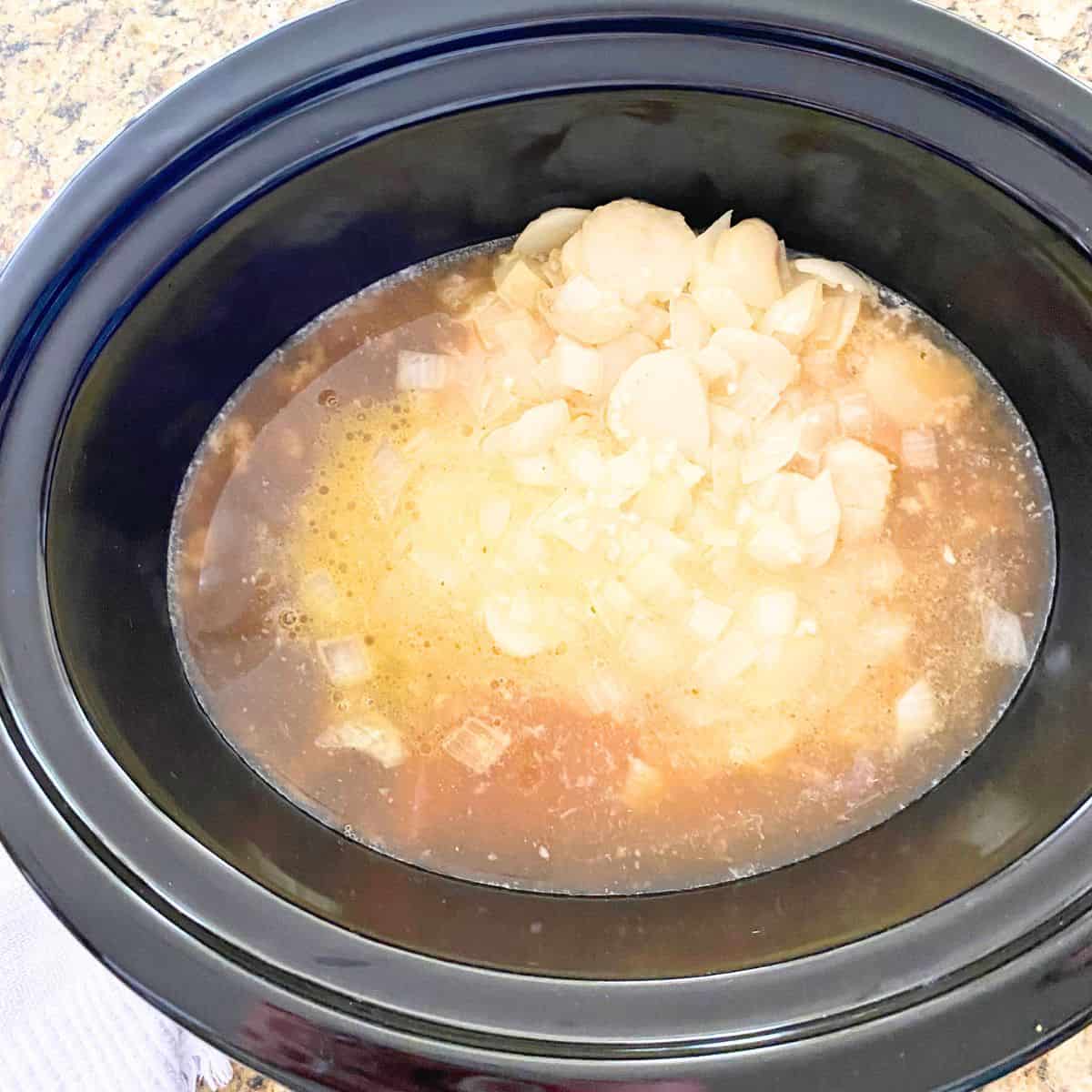 sautéed white onion mixture added to a slow cooker