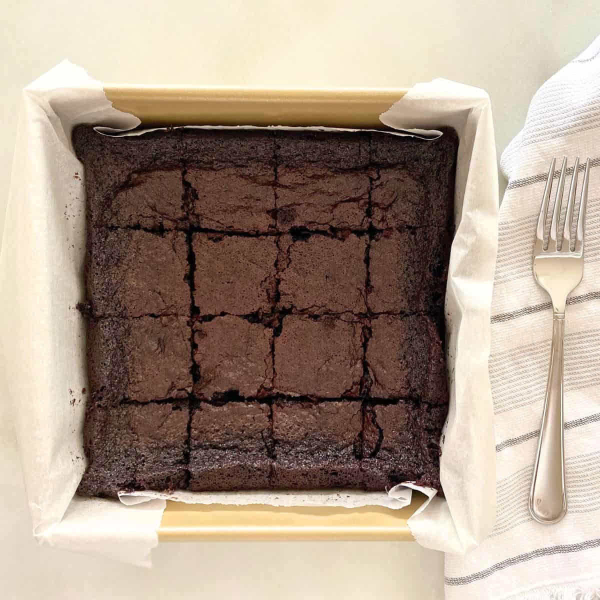 Gold cake pan with brownies cut into squares