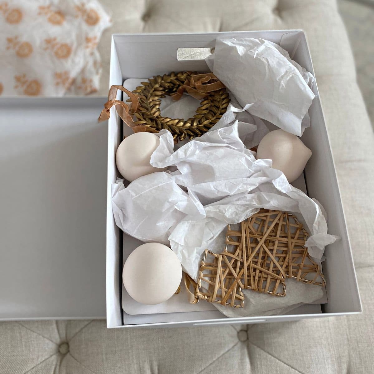 variety of Christmas ornaments stored in a box