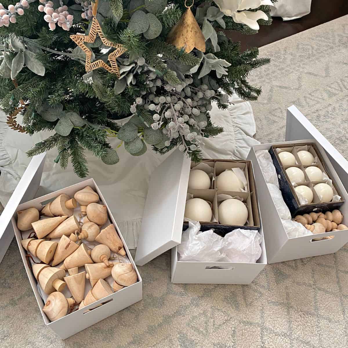 Christmas ornaments in white boxes with lids