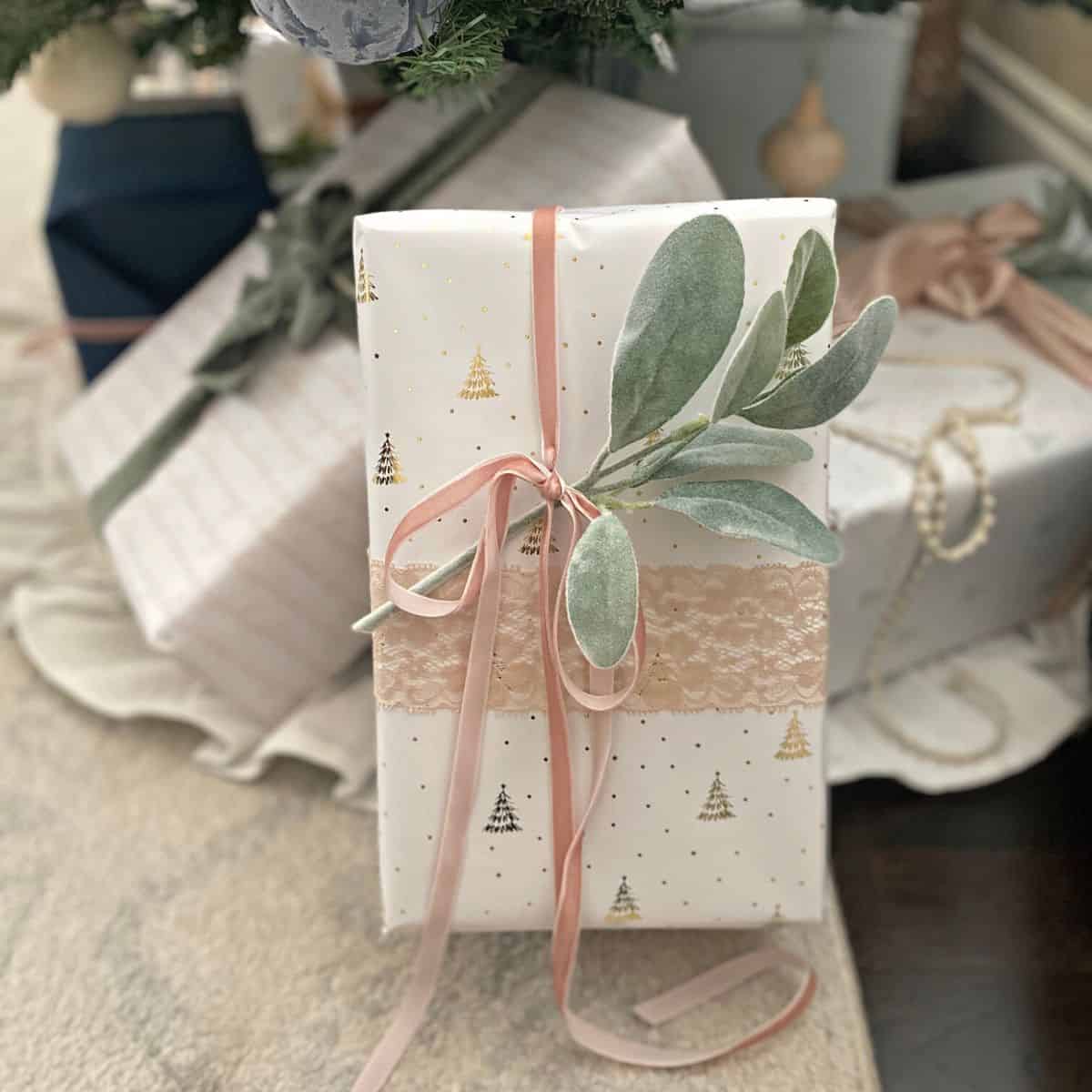 White present with pink bow and lambs ear pick gift topper