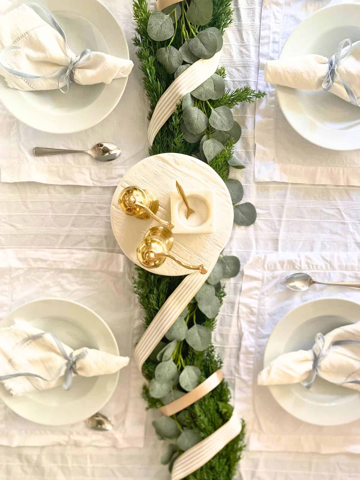 cedar garland used as part of a tablescape centerpiece