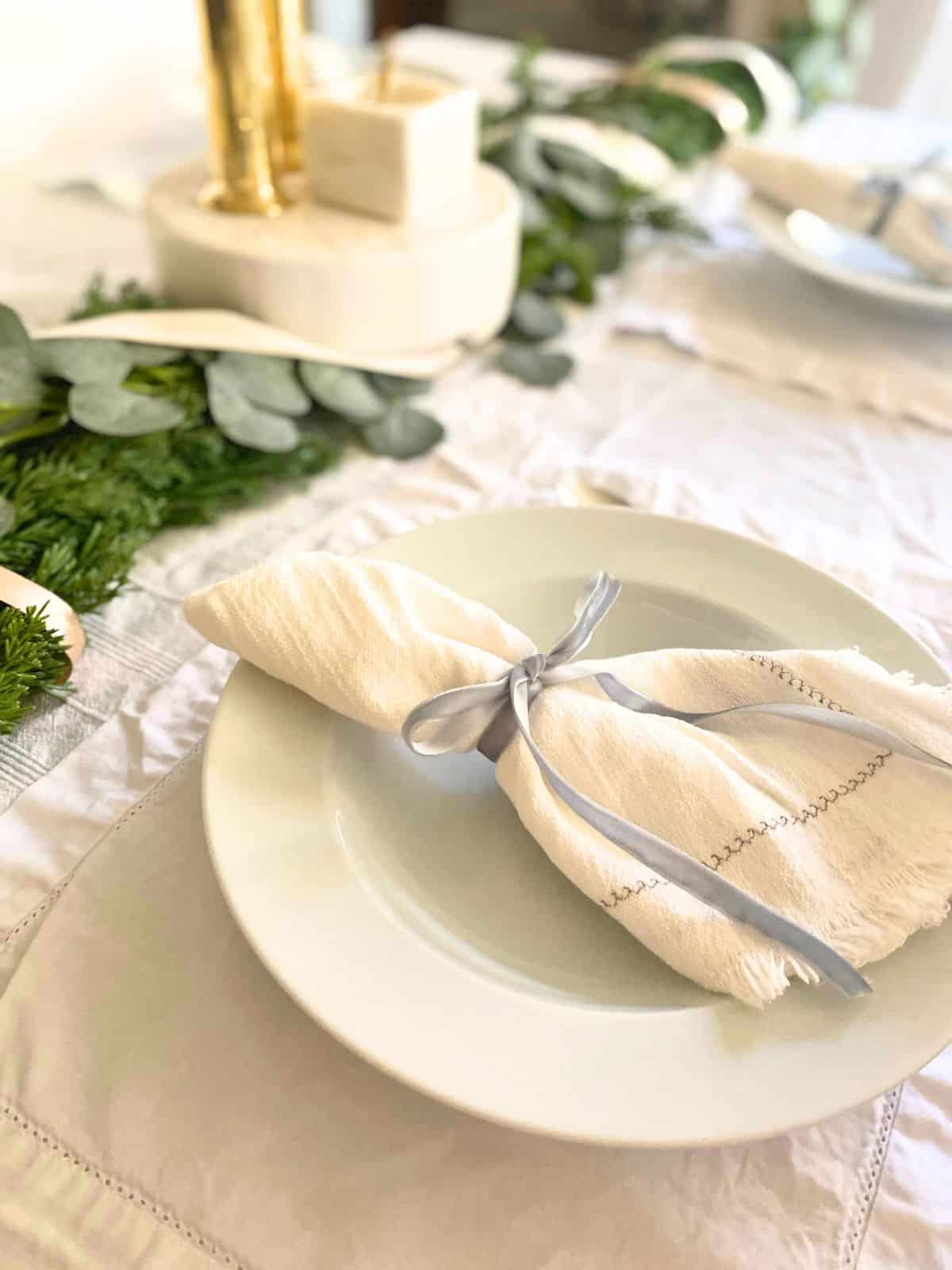 blue velvet ribbon used as a napkin ring