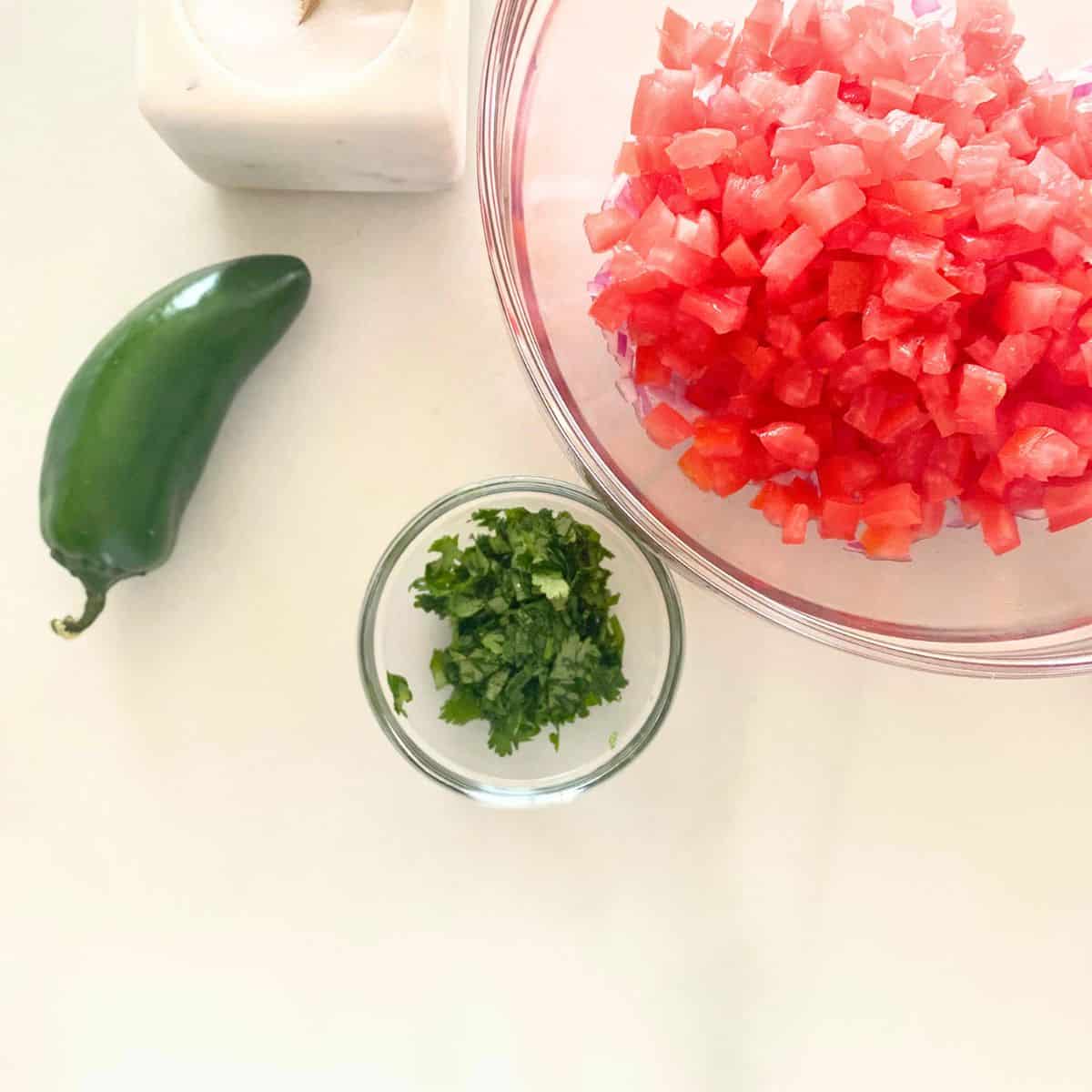 finely chopped fresh cilantro in small glass bowl