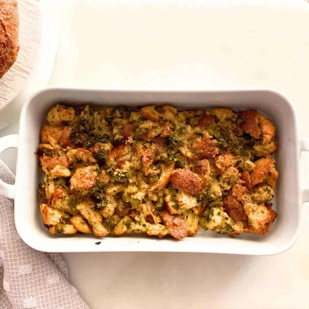 sage stuffing in a porcelain baker