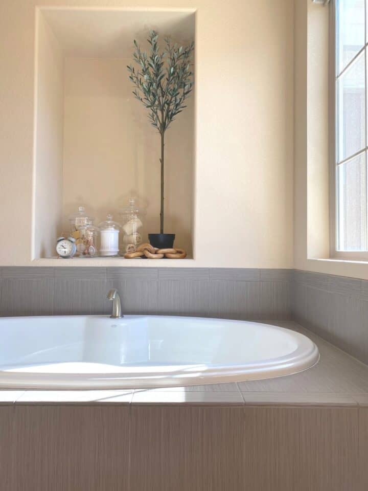 bathtub with bath accessories around it