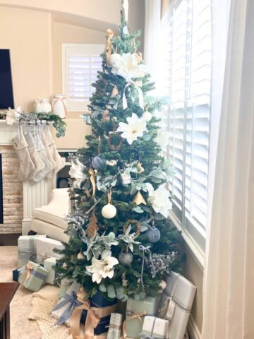 christmas tree decorated in blue, white, and wood coastal colors