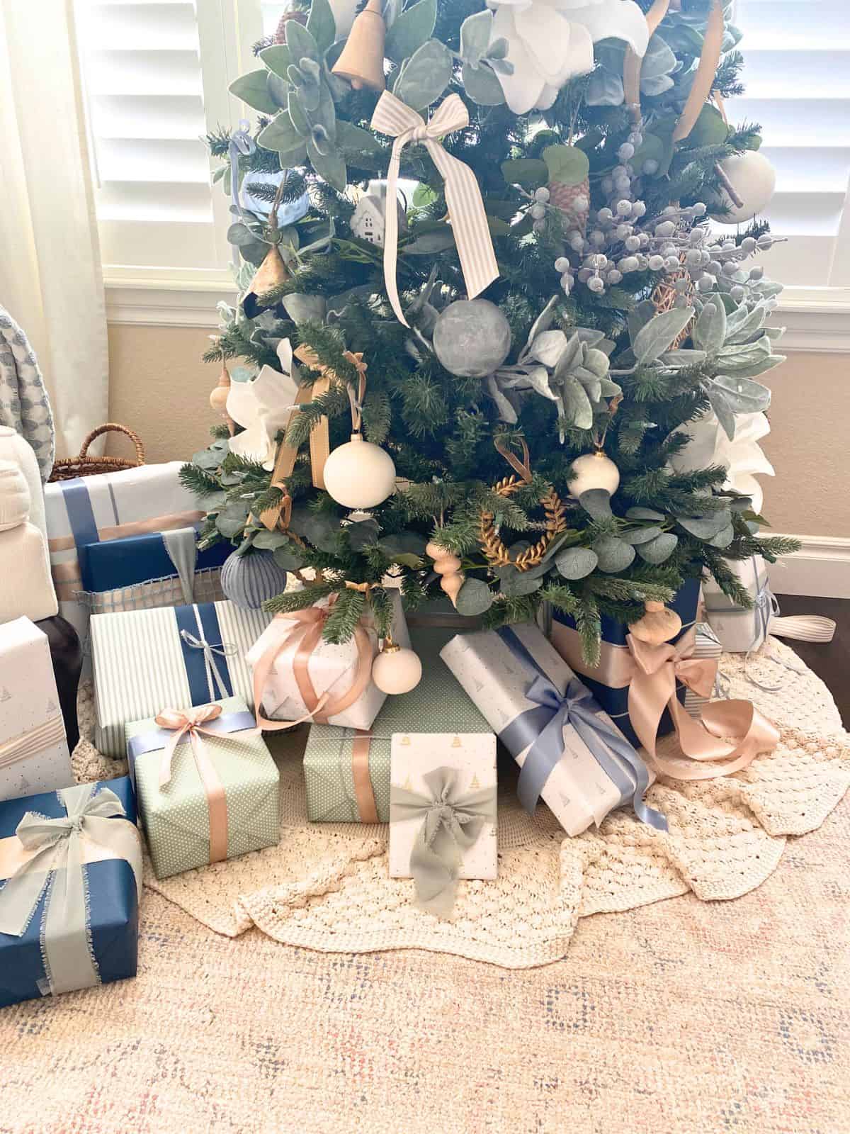 coastal pastel christmas presents under a tree