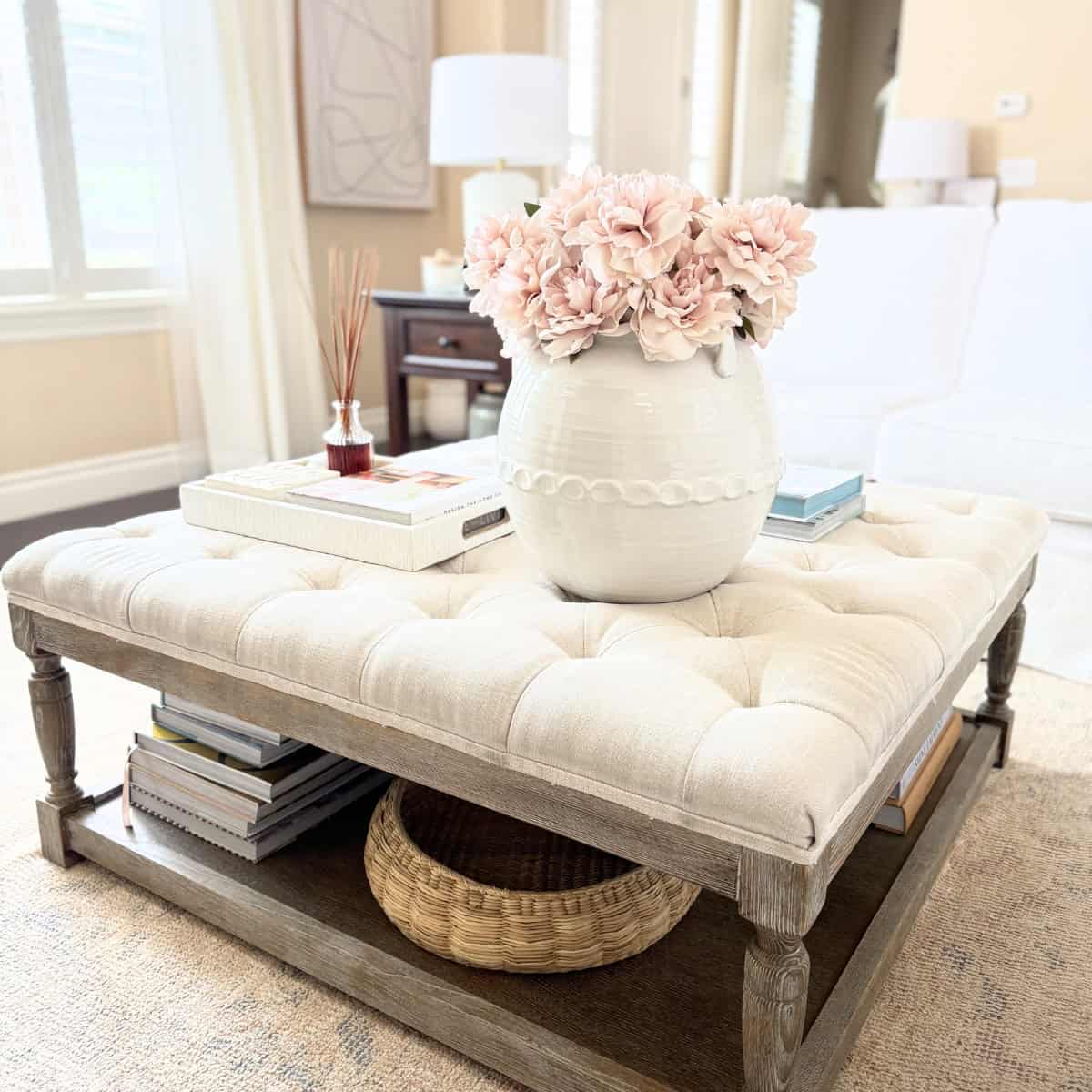 large vase and tray on ottoman