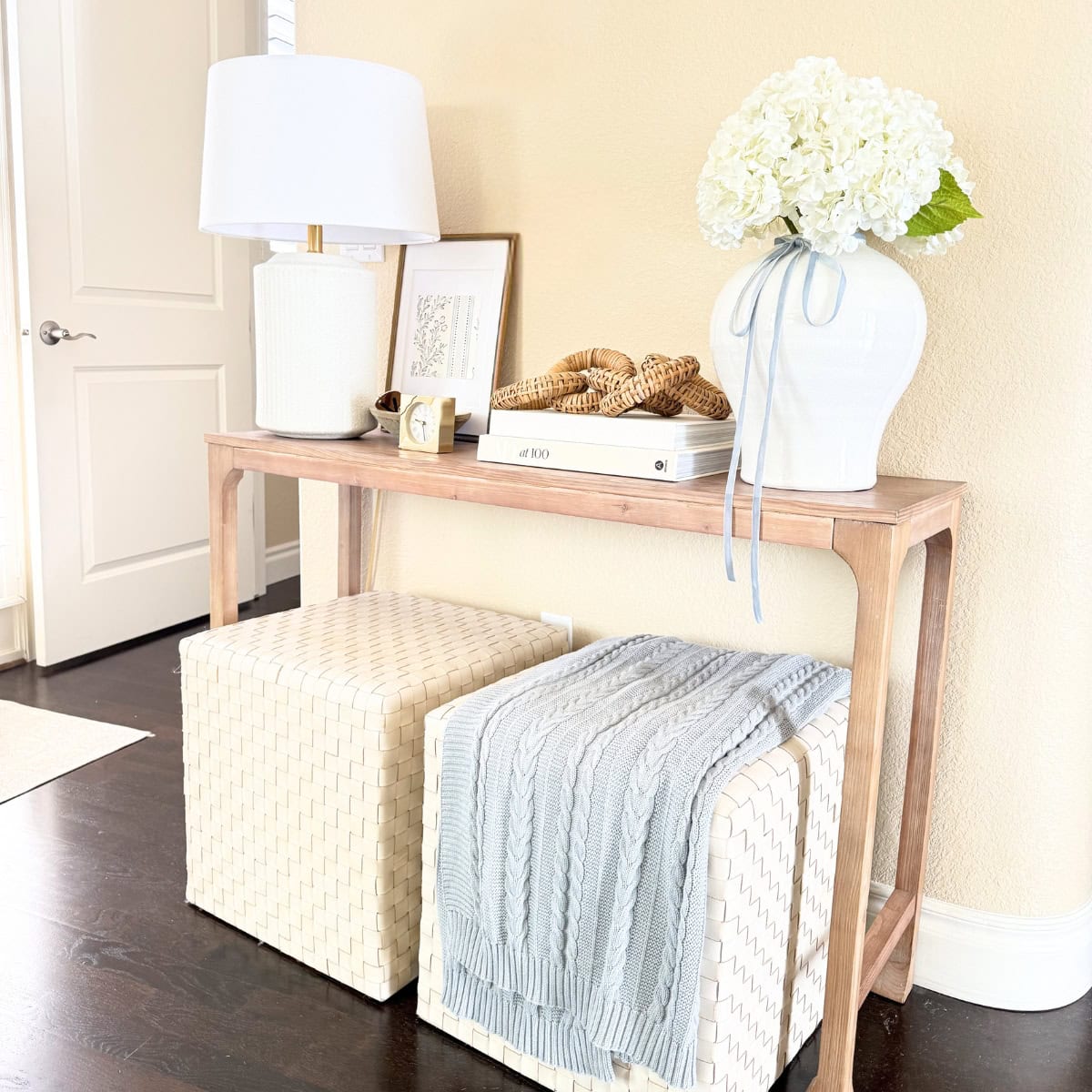 console table styled with books and decor