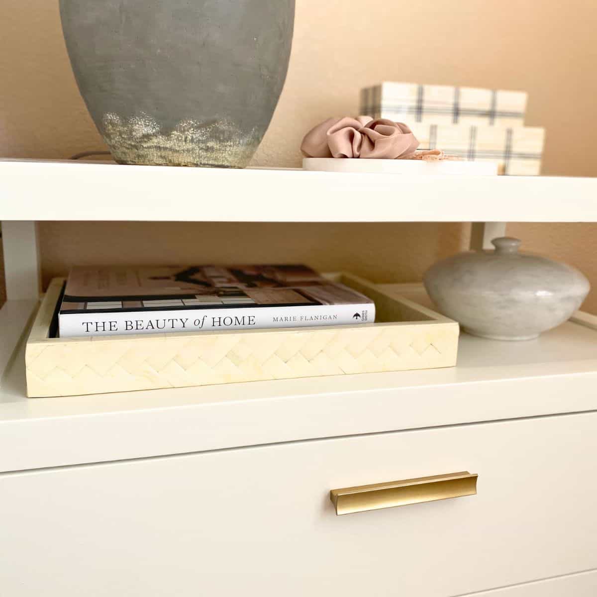 bone tray, boxes and marble lidded bowl decorated nightstand