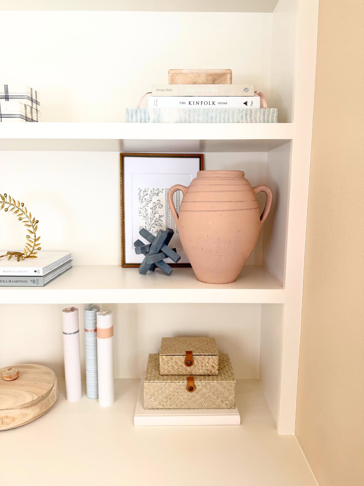 shelves styled with vases and books and other decor
