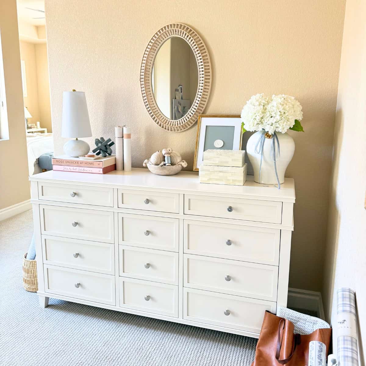 white dresser with decor on top