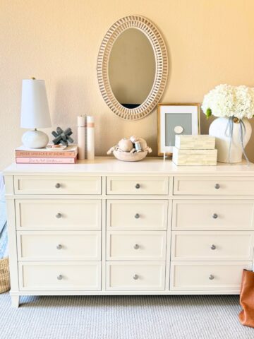white dresser with decor on top