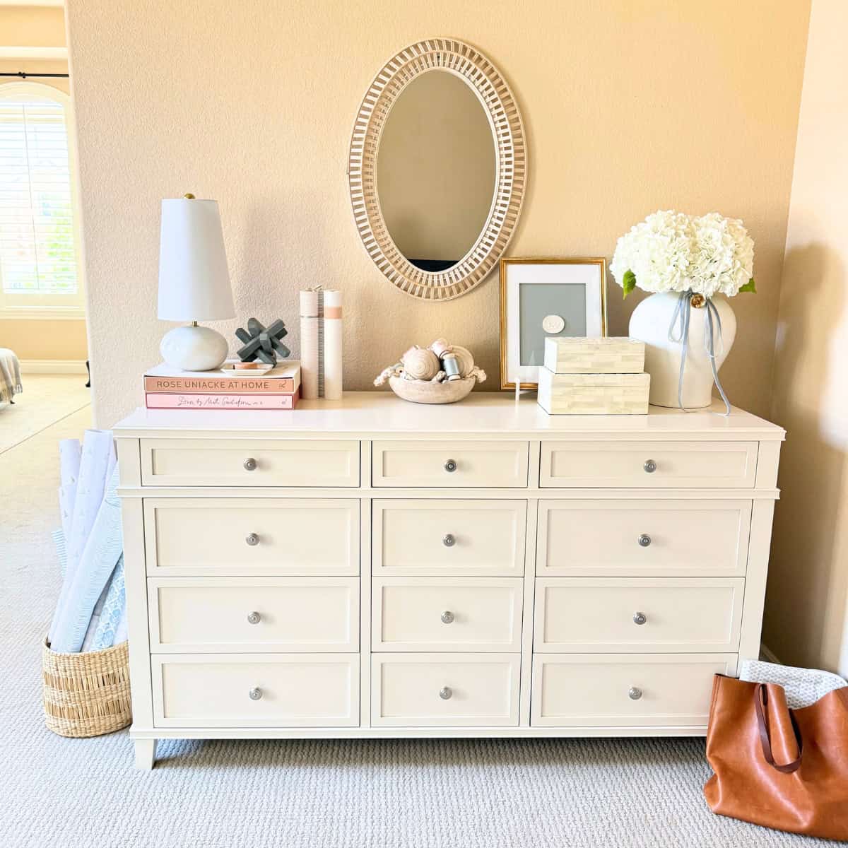 white dresser with decor on top
