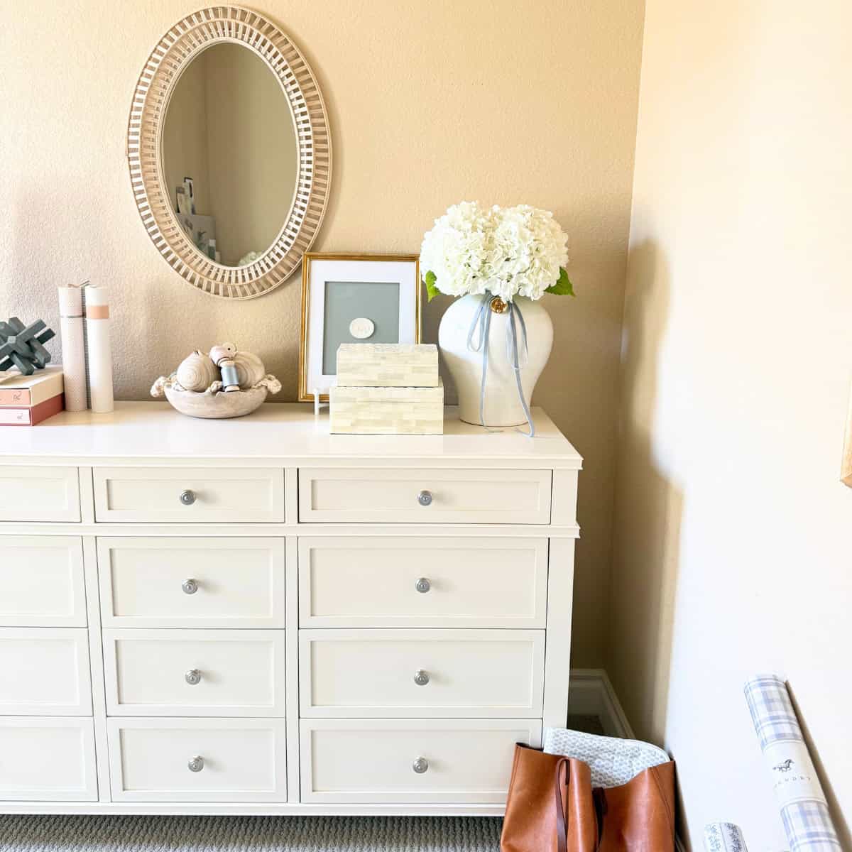 white dresser with decor on top
