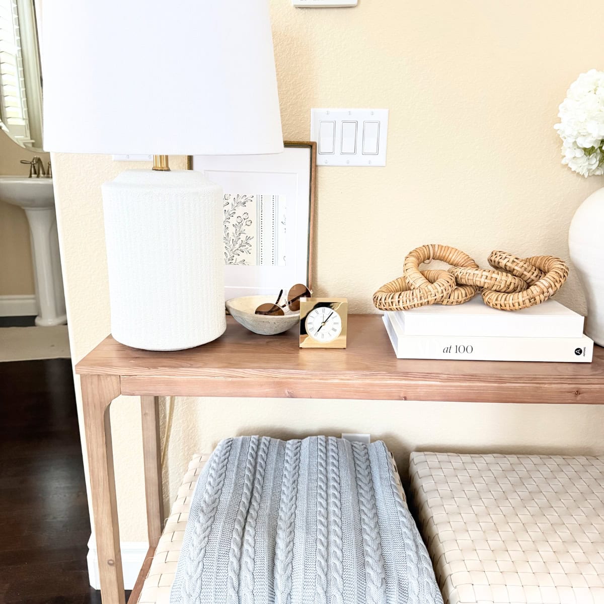 entry table decorated with books and art