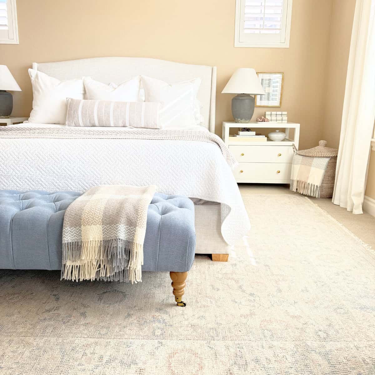 upholstered bed frame in styled bedroom