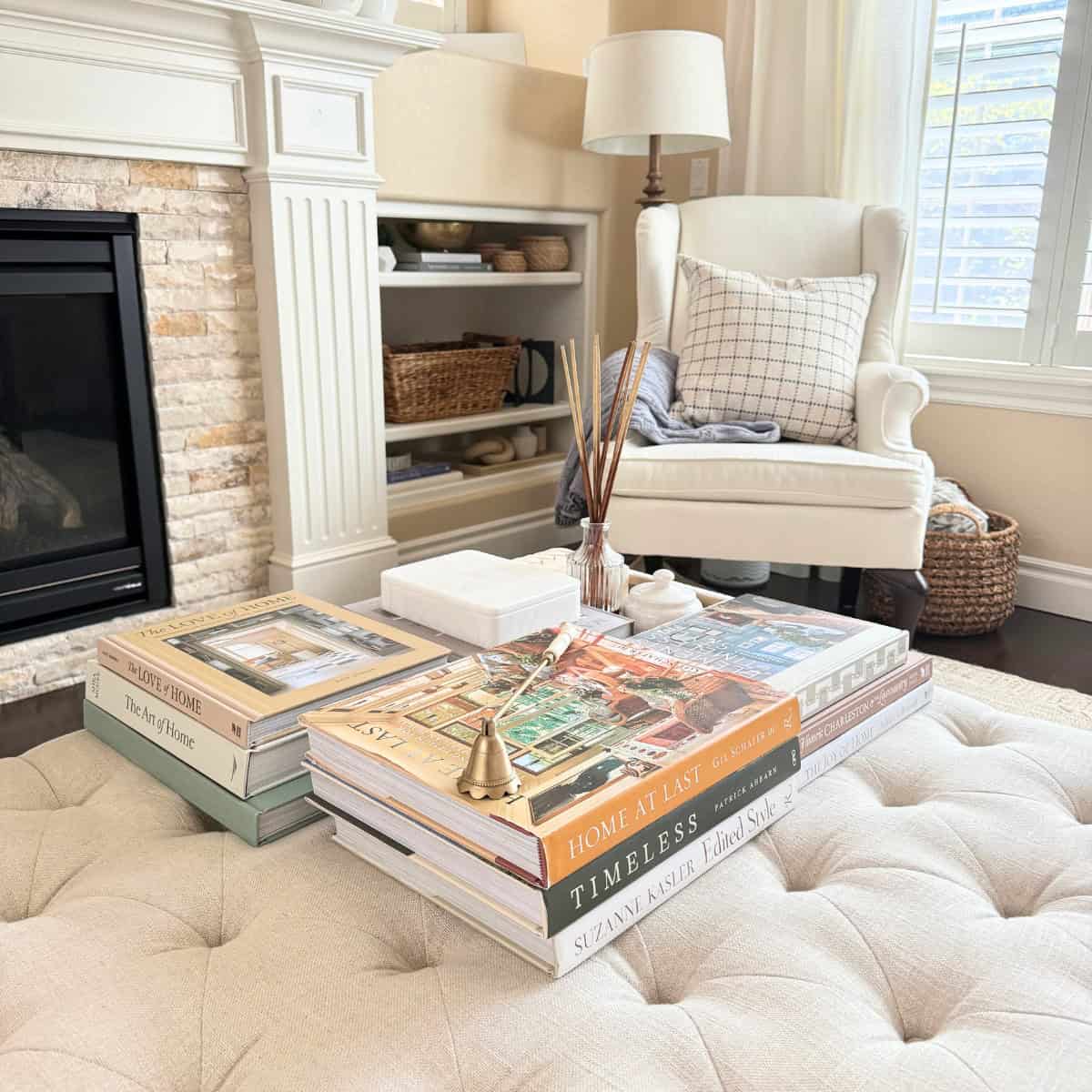 coffee table stacked with books in fall colors