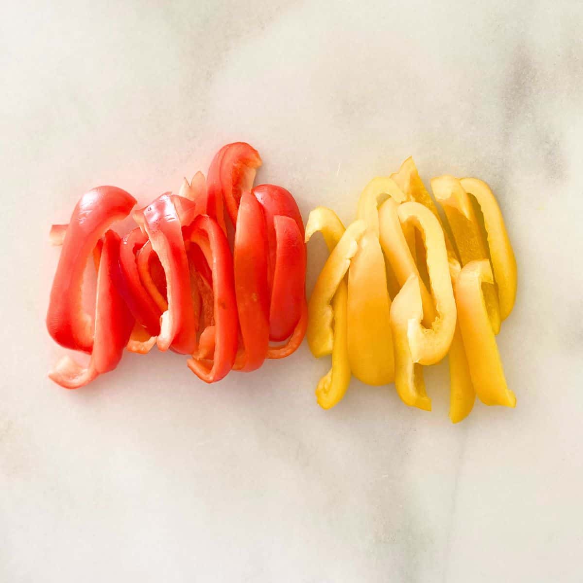 Sliced fresh bell peppers one red and one yellow