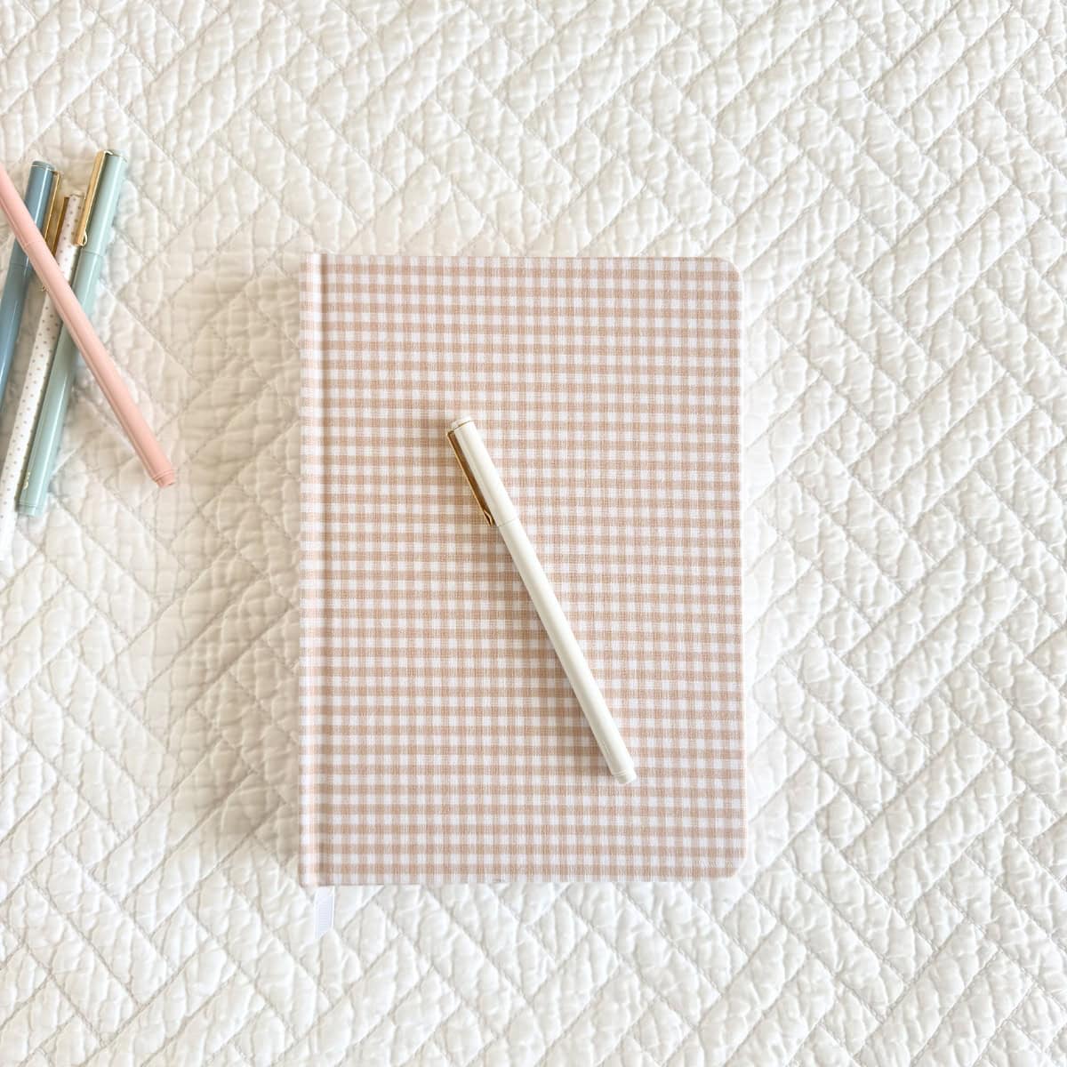 small pink fabric bound gingham journal