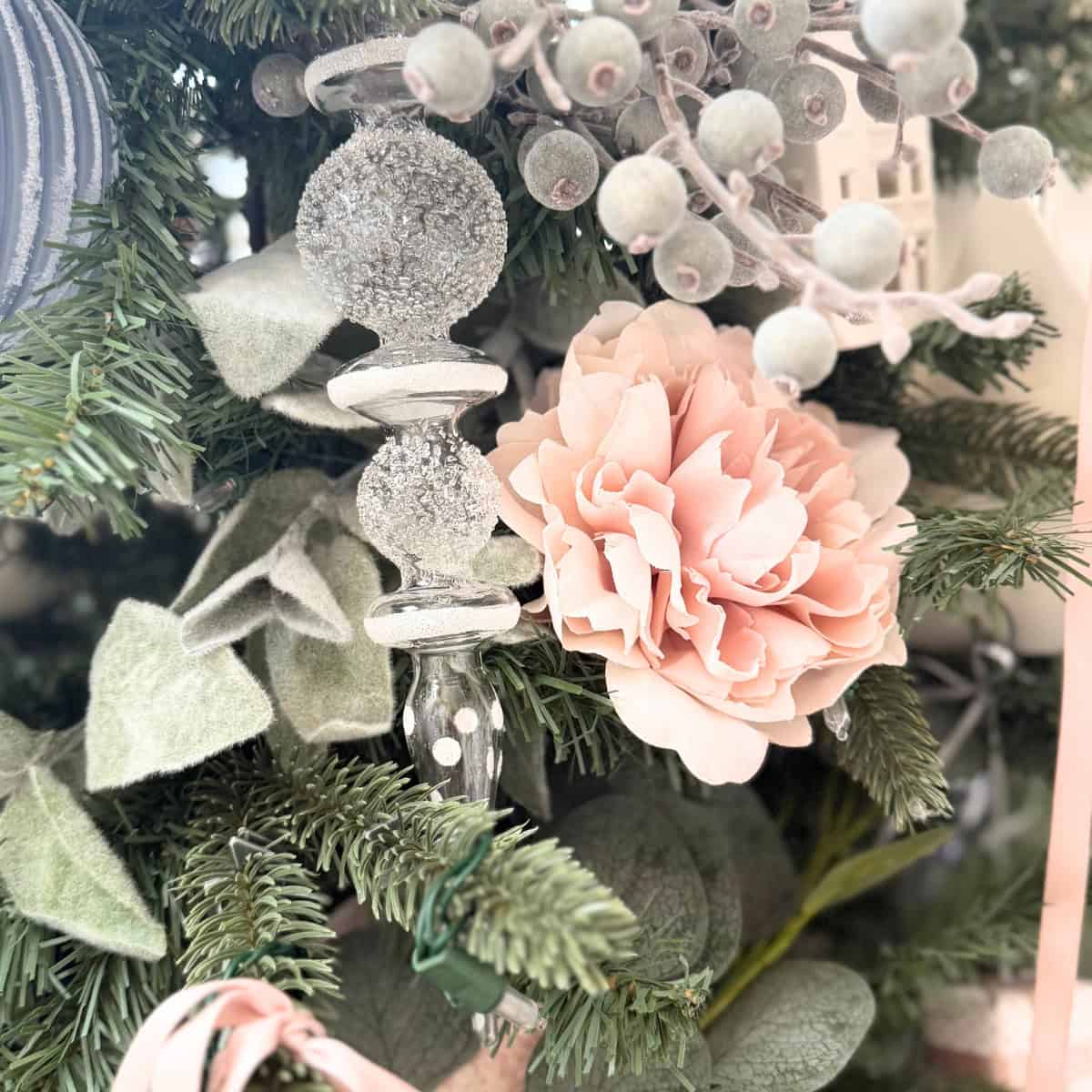 glass finial and pink peonies styled on tree