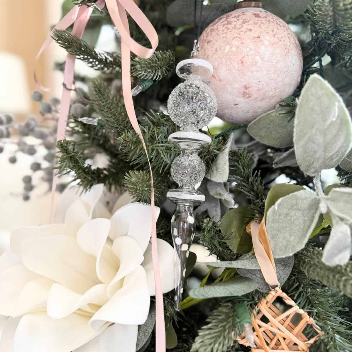 glass finial christmas ornament styled on tree