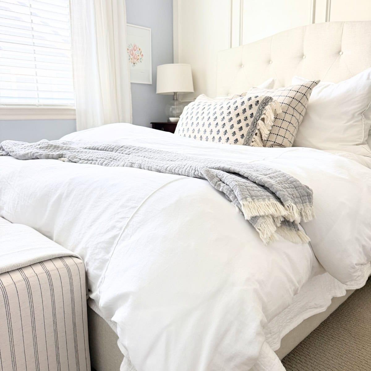 white and blue bedding on bed