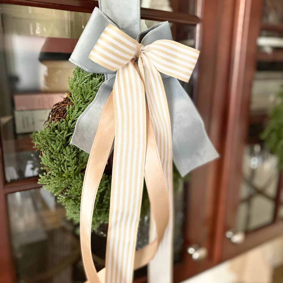 wreath hanging on cabinet
