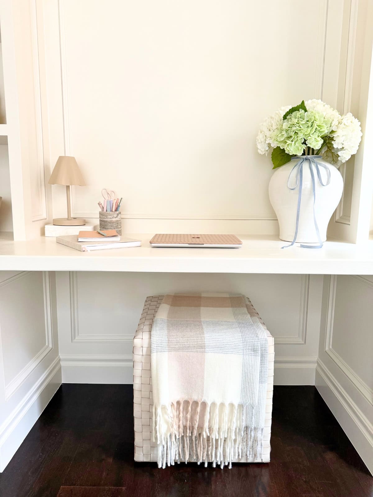 white built-in desk with ottoman