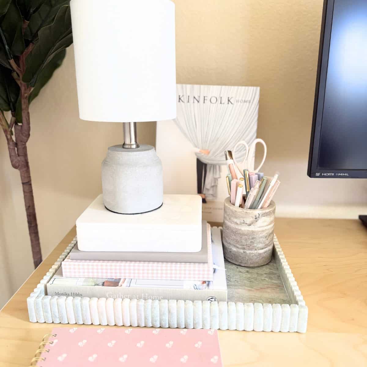 desk accessories in tray on desk