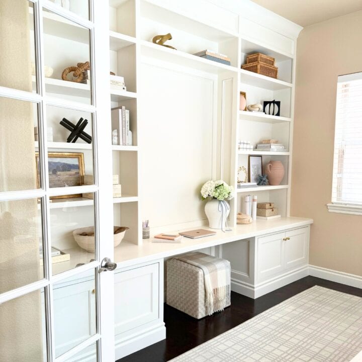 home office built-in desk painted white with ottoman