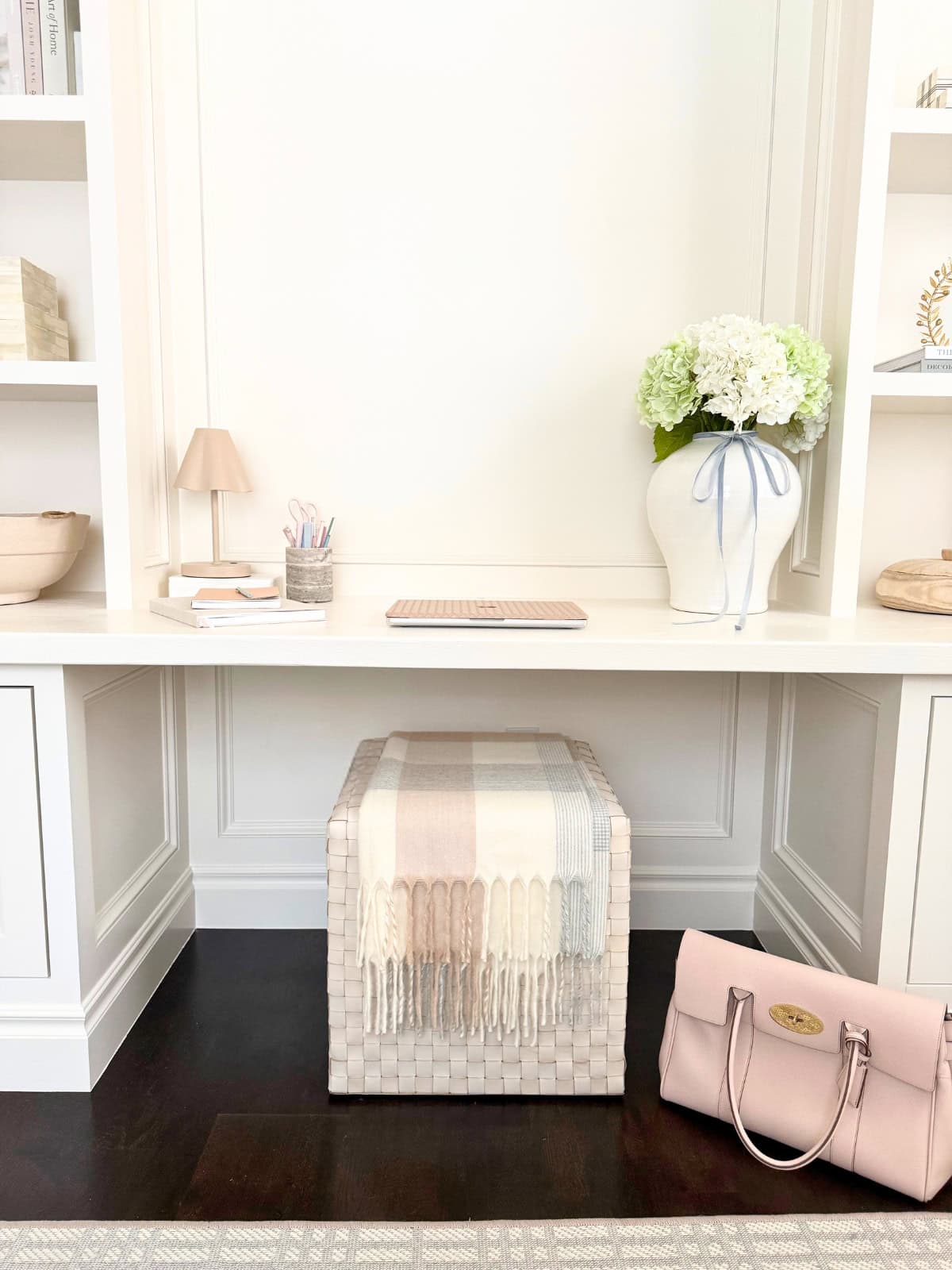 white built-in desk with ottoman